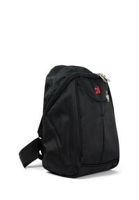 Black fabric backpack with a textured surface, zip closure, adjustable strap, and a logo detail on the front. Compact and practical design.
