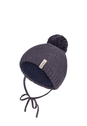 Knit hat in dark gray with a pom-pom on top. Features a soft blue lining and ties for secure fit. Woven texture and brand tag visible.