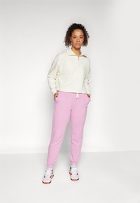 Reebok FRENCH TERRY - Tepláky - rose
