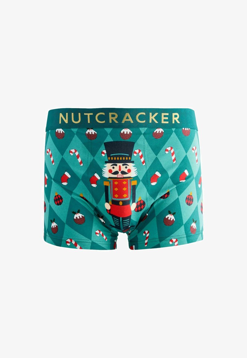 Grønne boxershorts med et nisseknækker-design, slikstokke og ornamenter på et diamantmønster, med en gylden "NUTCRACKER" linning.