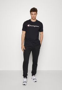 Champion BASIC CUFF PANTS - Tepláky - black