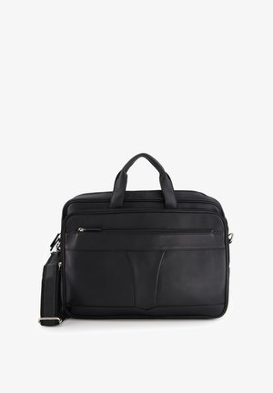 Sort lædertaske med dobbelt hanke, aftagelig skulderrem, lynlåslomme foran og tekstureret overflade. Slankt design med minimal hardware.