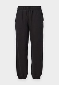 Zwarte sweatpants met een elastische tailleband, cuffed enkels en zijzakken. Zachte stof met een gladde textuur, geschikt voor casual wear.