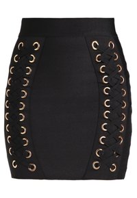 Falda negra con cordones entrelazados y ojales en tono dorado a los lados. Fabricada con una tela suave y estructurada.