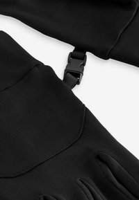 Black gloves with a smooth texture, featuring a buckle strap for adjustment and contoured finger sections for a fitted design.