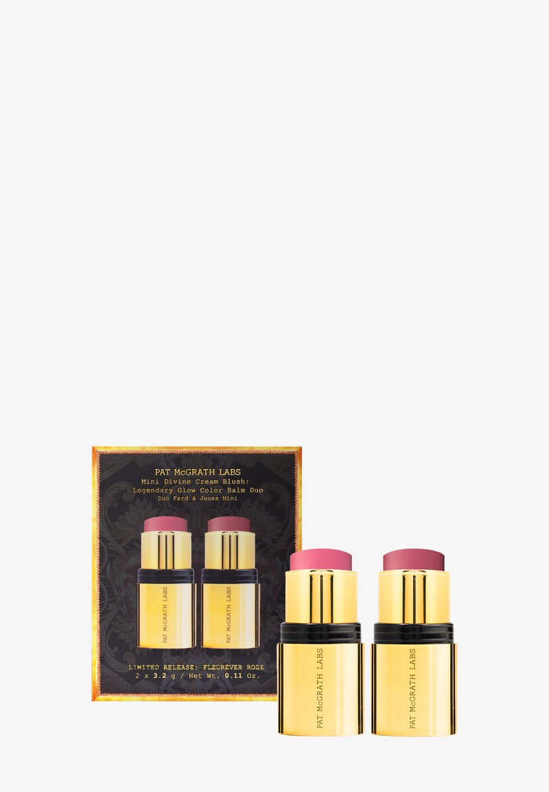 Mini Divine Cream Blush Duo, bestehend aus zwei goldenen und schwarzen Behältern mit rosa und rosefarbenen Cream Blushes, präsentiert in einer gemusterten Box.