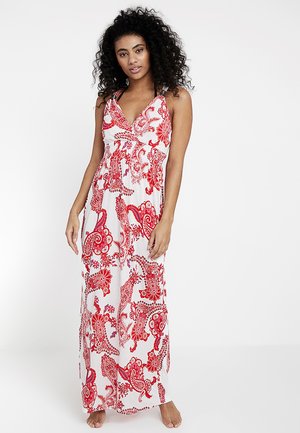 Maxikleid aus leichtem Stoff, mit einem roten Paisleymuster auf weißem Hintergrund, spaghetti-Trägern und einem ausgestellt geschnittenen Saum.