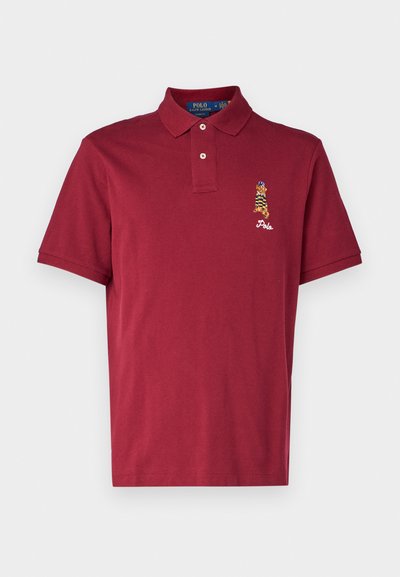 Burgundowa koszulka polo z bawełny, z dwoma guzikami, krótkimi rękawami i haftowanym logo z wzorem tygrysa na klatce piersiowej.