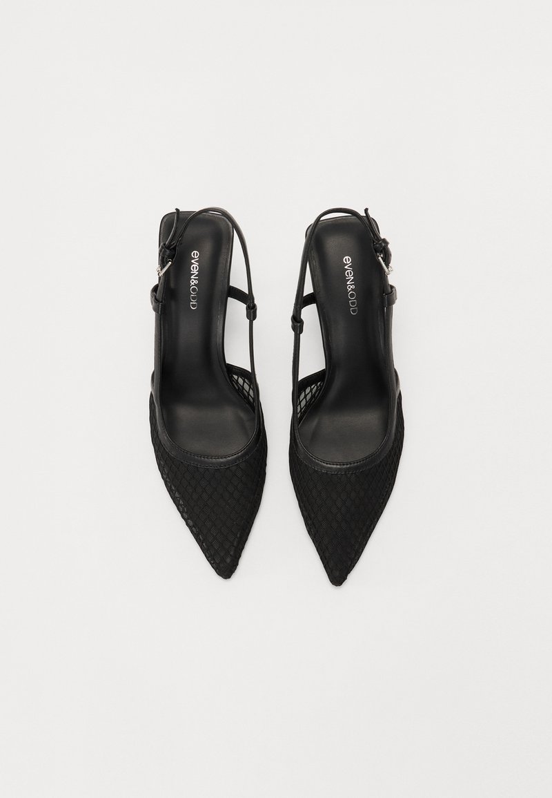 Chaussures slingback noires à bout pointu avec un motif tissé et des fines sangles. Texture douce avec une doublure intérieure lisse. Marquage sur la semelle intérieure.