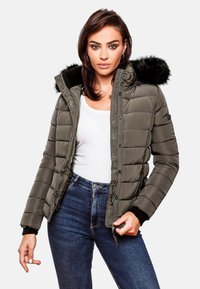 Padded olive green jacket with a fur-lined hood, zip closure, and ribbed cuffs. Worn over a white top and paired with dark jeans.