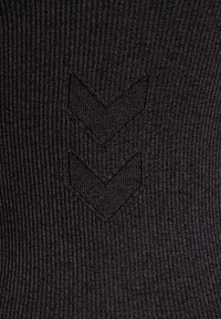 Dark ribbed fabric with three downward-pointing chevron patterns knitted into the texture.