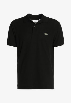 Polo shirt nera in tessuto di cotone, con colletto classico, maniche corte e un piccolo logo verde di Lacoste sul lato sinistro del petto.