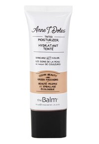 Tönad fuktkräm i en vit plasttub med brun bas. Svart kork, tryckt text i olika typsnitt som lyfter fram miljövänliga aspekter.