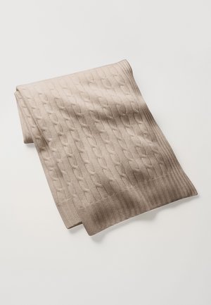 Beige knitted scarf with a cable pattern and ribbed edges. The fabric appears soft and textured, folded neatly for display.