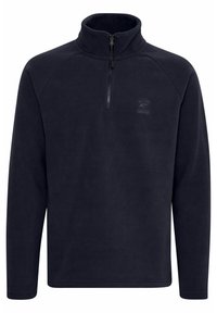 Sudadera de forro polar azul marino con cuello de media cremallera, que presenta mangas raglán y un sutil detalle de logo en el pecho. Tejido suave y texturizado.