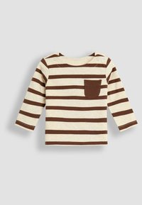 Prune ja kreemi triibuline pikakä sleevesärk, millel on rinnaehe, pehme kangas ja õlale kinnitamiseks nööbid, mis võimaldavad lihtsat riietumist.