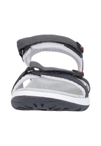 Gray sandal with adjustable straps, textured gray fabric, cushioned white footbed, and black rubber sole featuring tread patterns.