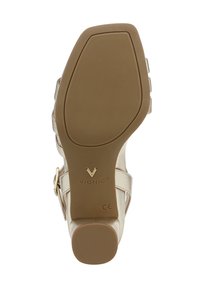 Light gold heel with a smooth finish, featuring a rounded toe and wide strap with a buckle. Textured rubber sole for grip. Vionic branding.