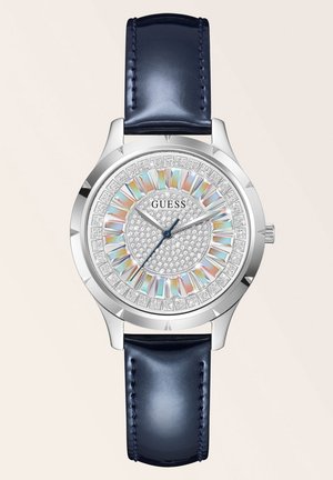 Silberne Uhr mit rundem Ziffernblatt, mit Strasssteinen verziert, mehrfarbigem Ring und dunkelblauem Lederarmband. Verfügt über ein glitzerndes Ziffernblatt und silberne Zeiger.