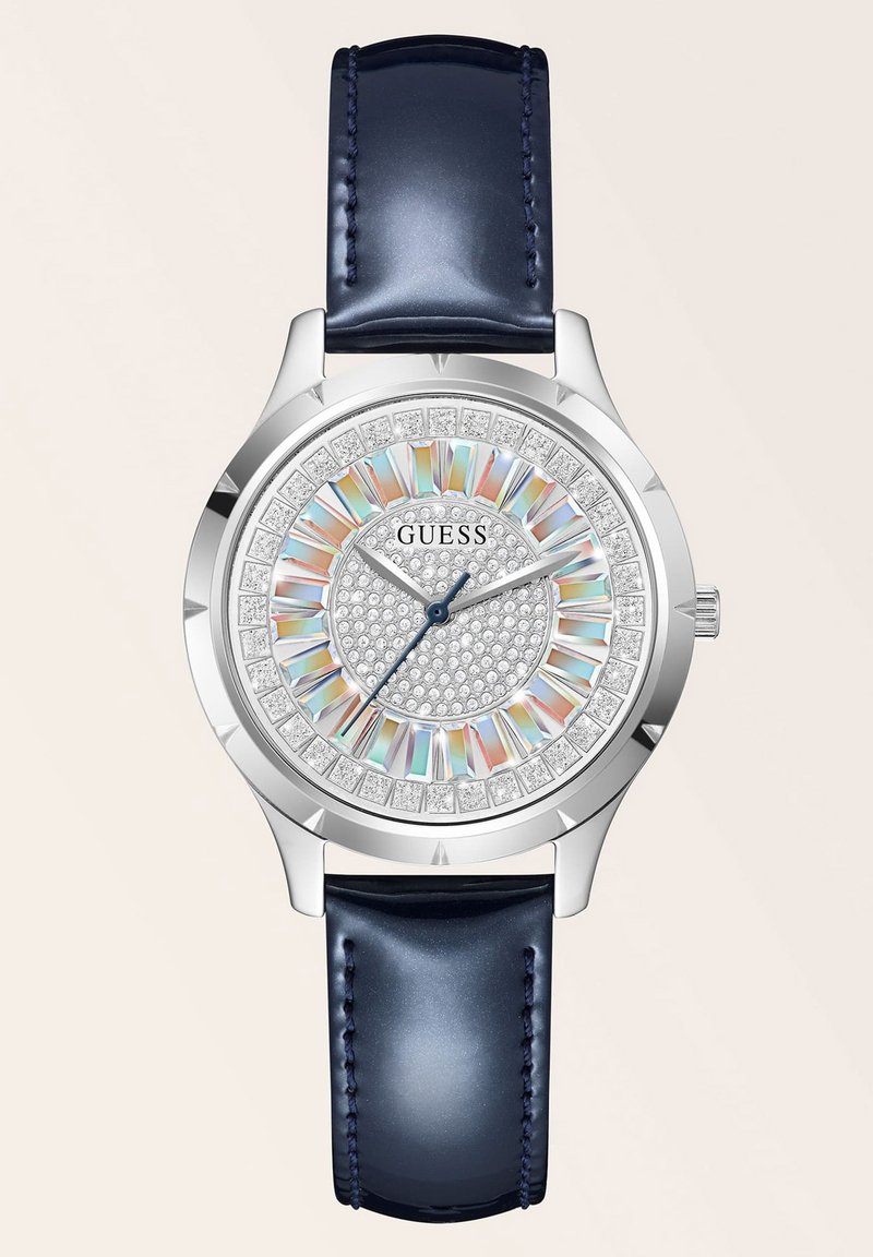 Silberne Uhr mit rundem Ziffernblatt, mit Strasssteinen verziert, mehrfarbigem Ring und dunkelblauem Lederarmband. Verfügt über ein glitzerndes Ziffernblatt und silberne Zeiger.