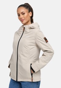 Beige hooded jacket with a front zipper, black accents, elastic cuffs, and side pockets, featuring a mountain logo on the chest.