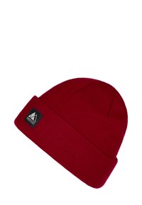 Czerwona wełniana czapka z dzianiny o żebrowanej fakturze, z podwiniętym mankietem i czarną metką z logo marki "PROTEST" z boku.