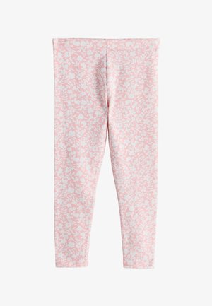 Leggings roses avec motifs floraux blancs et feuilles, tissu extensible et silhouette ajustée.