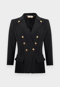 Μαύρο, διπλό σακάκι με έξι χρυσά κουμπιά, φαρδιές πέτες, κάθετες ραφές και τσέπες με καπάκι, σε φωτεινό φόντο.