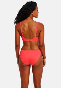 Coral bikini set with adjustable straps and a clasp closure on the back. The material appears smooth with minimal stitching details.