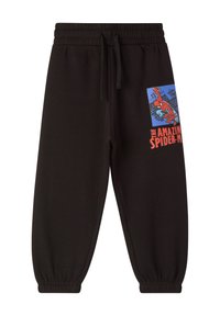 Pantaloni della tuta neri con vita con cordino, caratterizzati da una grafica blu e rossa di Spider-Man nella zona della tasca sinistra. Caviglie a coste.