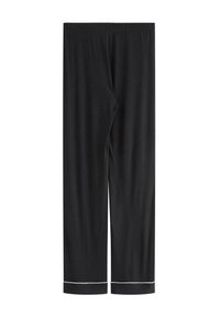 Pantaloni neri a gamba dritta con cintura elastica e dettagli in piping bianco lungo gli orli inferiori, esposti piani su uno sfondo bianco.
