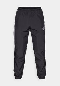 Schwarze Sporthosen aus glattem, leichtem Stoff, mit elastischem Bund, weißen Seitenstreifen und einem kleinen Logo an der Hüfte.