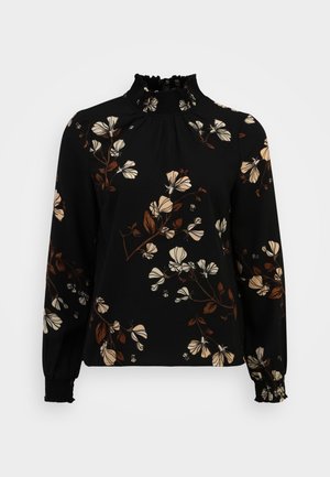 Blusa negra de manga larga con estampado floral en beige y marrón, cuello alto con volantes y puños elásticos en las mangas.