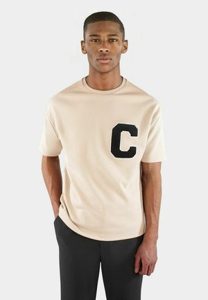 ICY  - T-shirt med print - beige