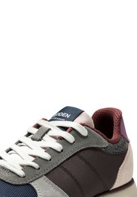 Multicolored sneaker with gray, burgundy, and pink textile; features white laces, a navy logo patch, and a textured heel accent.