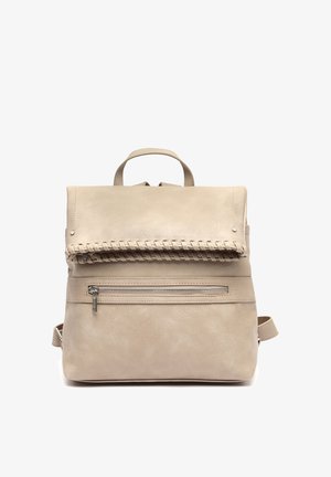 Beige leather backpack with top handle, silver zipper pocket on front, and decorative stitched flap detail.