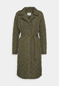 Olive green quilted coat with a pointed collar, belt, and button closure. Features a diamond pattern and long sleeves. Lightweight fabric.