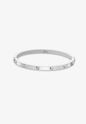 Silver bangle bracelet with a smooth, polished surface. Features five evenly spaced clear rhinestones along the outer edge.