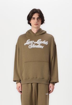 Olive green hoodie with white "Low Lights Studios" logo, featuring a kangaroo pocket, ribbed hem and cuffs, and a relaxed fit design.