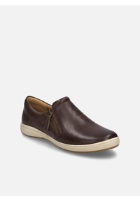 Brown leather slip-on shoe with a side zipper, minimalist design, rounded toe, and a textured white rubber sole.