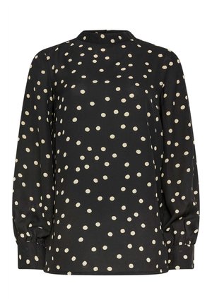 Blusa negra de manga larga con cuello alto, que presenta un patrón de lunares en color crema. Mangas abullonadas con puños elásticos. Textura de tela suave.