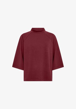 Maglione corto a maniche corte color bordeaux con vestibilità ampia e maniche raglan, in tessuto semplice, esposto su sfondo bianco.