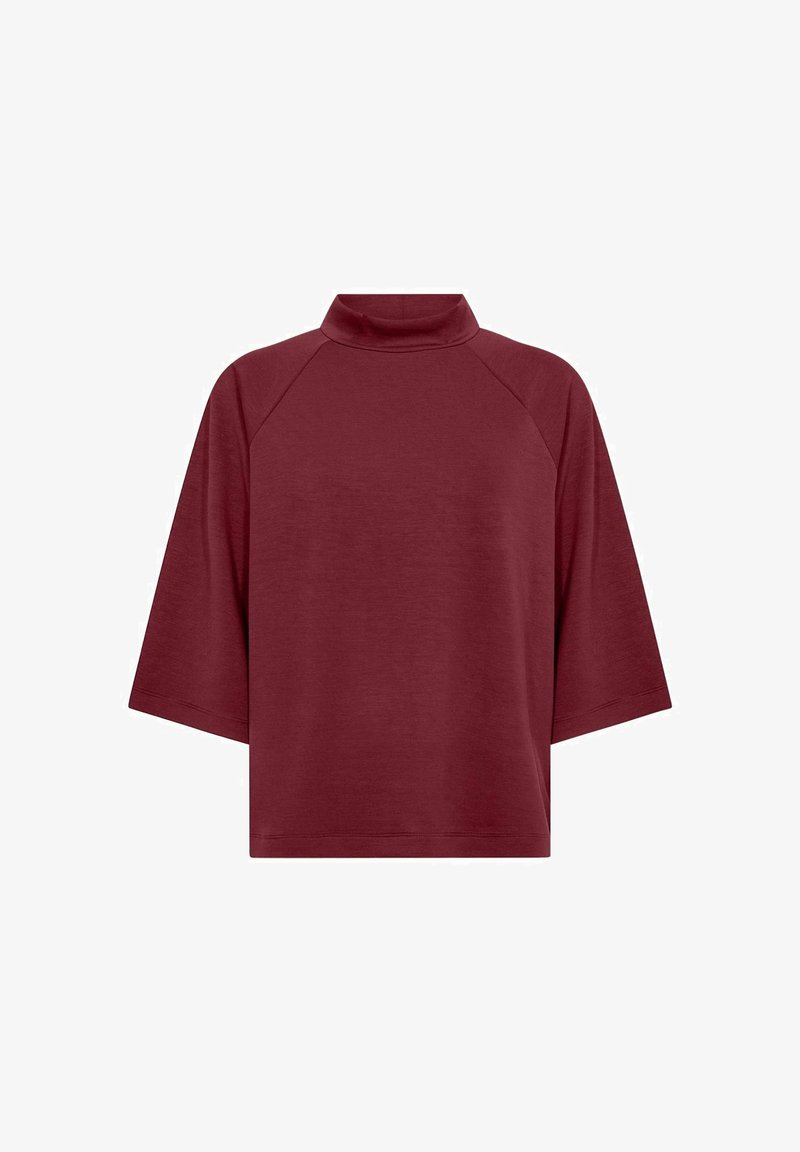 Maglione corto a maniche corte color bordeaux con vestibilità ampia e maniche raglan, in tessuto semplice, esposto su sfondo bianco.