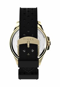 Montre Timex avec un bracelet en caoutchouc noir présentant un motif texturé, des éléments en or et un fond en acier inoxydable. Cadran rond blanc.