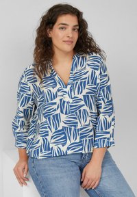 Blauw-wit geblokte blouse met een V-hals, lange mouwen en een ontspannen pasvorm, met een bladmotief op zachte stof.
