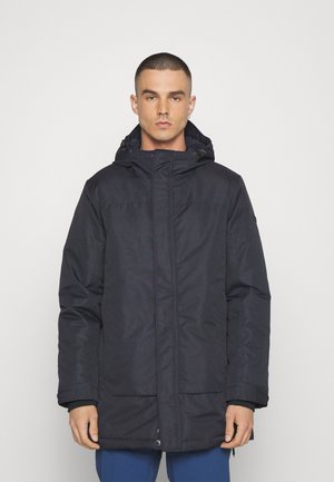 Tung mörkblå parka jacka med huva, dragkedjestängning, två framfickor, elastiska ärmslut och en slät, texturerad yta.