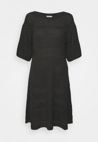 Robe en tricot noire longueur genou avec manches courtes bouffantes et détails en ajouré à motifs sur toute la surface.