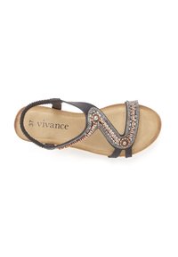 Schwarze Sandale mit dekorativen metallischen Perlenakzenten und filigranen Nähten an den Riemen; beige gepolsterte Innensohle; Größe 37.