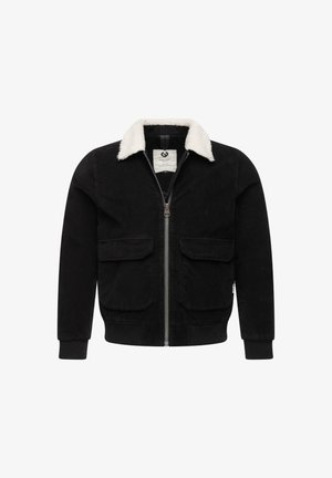 Fekete kordbársony dzseki krémszínű műszőrmével bélelt gallérral, elöl cipzárral záródik, és két zsebbel rendelkezik. Bordázott mandzsetták és derékpánt.