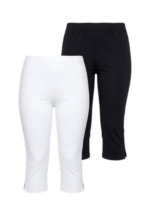 Twee paar eenvoudige korte leggings, één wit en één zwart, met elastische taillebanden en kleine zijslits aan de zoom.